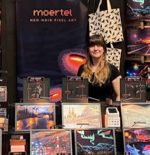Moertel booth with animated pixel art displays at a convention.
